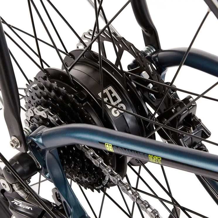 Detail view of the 250W rear hub motor and Shimano cassette on the EZEGO Commute Int, showing the robust drivetrain and black spokes.
