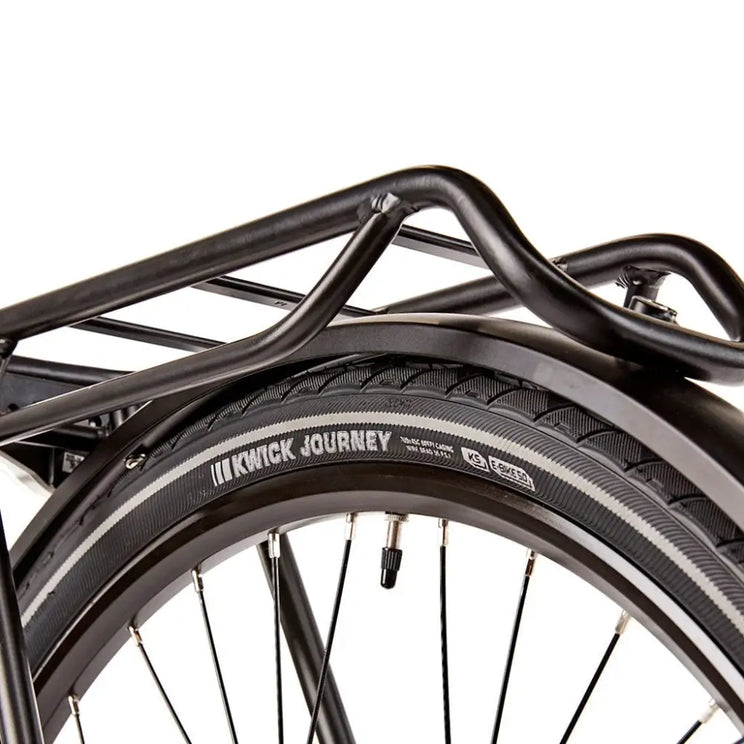 Close-up of the Kenda Kwick Journey puncture-resistant tyres and the sturdy rear pannier rack on the EZEGO Commute Int, designed for carrying luggage.