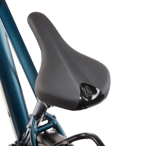 Close-up of the ergonomic comfort saddle on the EZEGO Commute Int Gents, featuring the branded logo and designed for long-distance urban riding