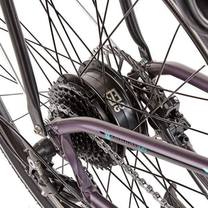 Detail view of the 250W rear hub motor and Shimano cassette on the EZEGO Commute Int, showing the robust drivetrain and black spokes.