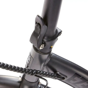 Detailed shot of the secure folding stem hinge and locking lever mechanism on the EZEGO Fold electric bike.