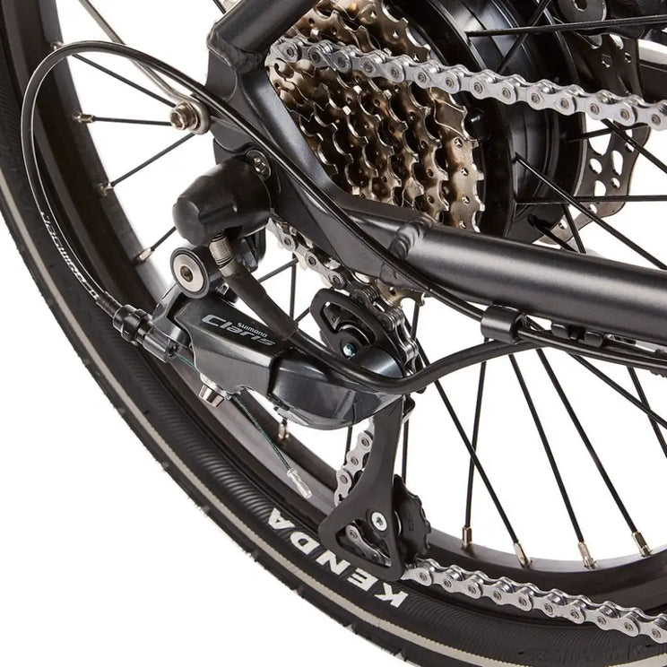 Close-up of the Shimano Claris rear derailleur and gear cassette on the EZEGO Fold electric bike.