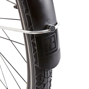 Close-up of the EZEGO branded logo on the matte black front mudguard of the Step NX bike.
