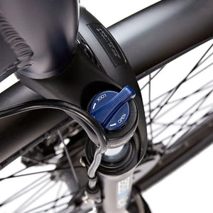 Close-up of the suspension fork lockout switch allowing for adjustable ride comfort on the EZEGO Step NX.