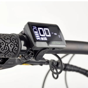 Close-up of the EZEGO Trail Destroyer II digital display showing battery level and speed on the handlebar.