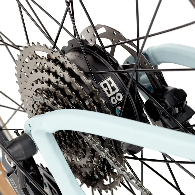 Close-up of the EZEGO Trail Destroyer II’s rear wheel showing the Shimano gear system and integrated EZEGO hub motor with disc brake.