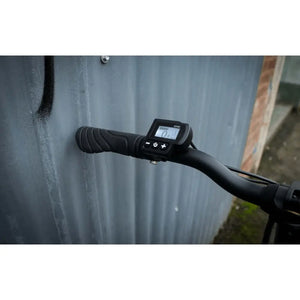 Close-up of the Falcon Compact Electric Folding Bike LCD display showing speed and settings.