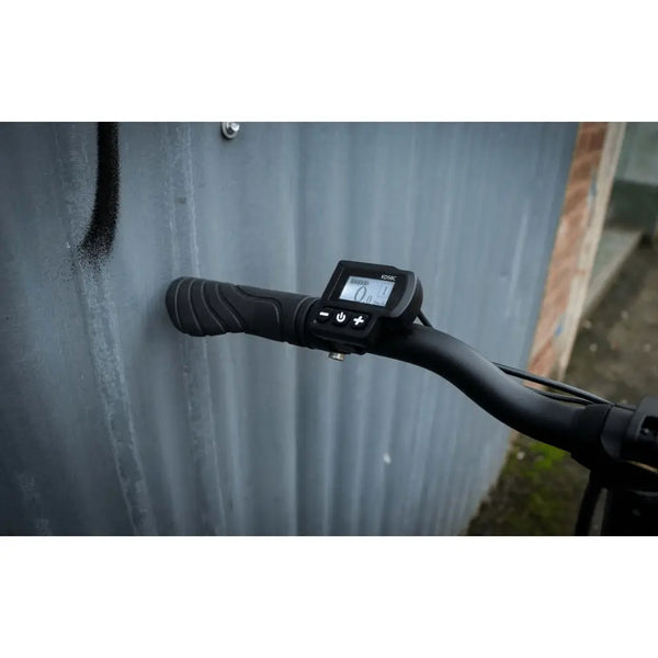 Close-up of the Falcon Compact Electric Folding Bike LCD display showing speed and settings.