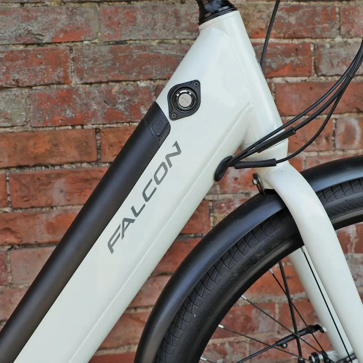 Detailed view of the Falcon Liberty downtube featuring the integrated battery security lock, weather-sealed charging port, and Falcon logo.