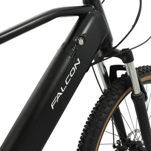 Detail view of the Falcon Turbine's downtube, highlighting the sleek integrated 36V battery design with the Falcon logo and security key lock mechanism.