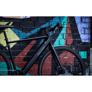 Falcon Zone Single Speed Electric Hybrid Bike 250W with a colourful graffiti wall background.