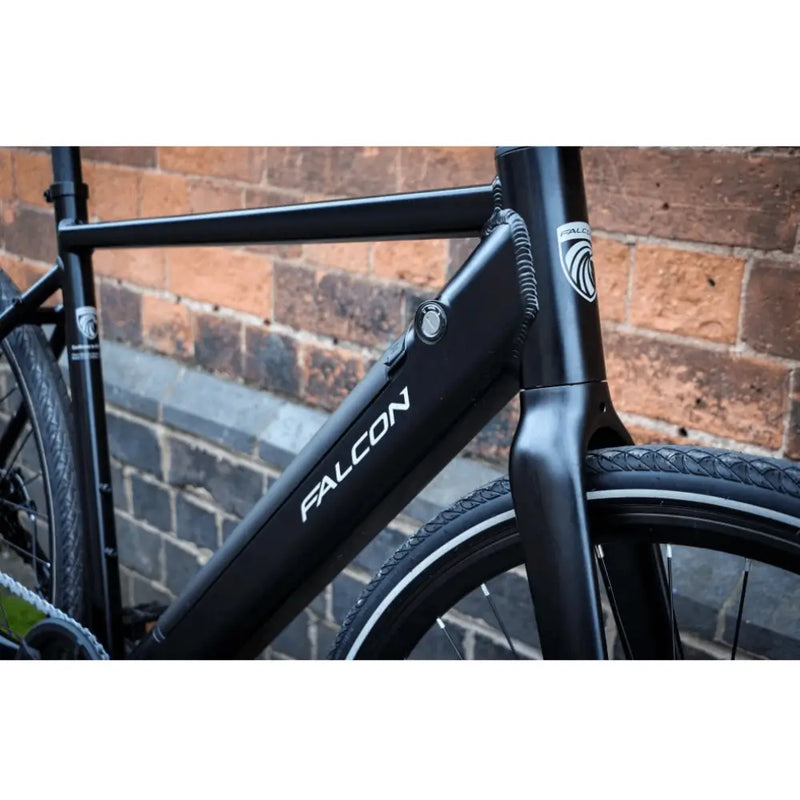 Detailed view of the Falcon Zone Single Speed electric hybrid bike frame with integrated battery and Falcon branding.