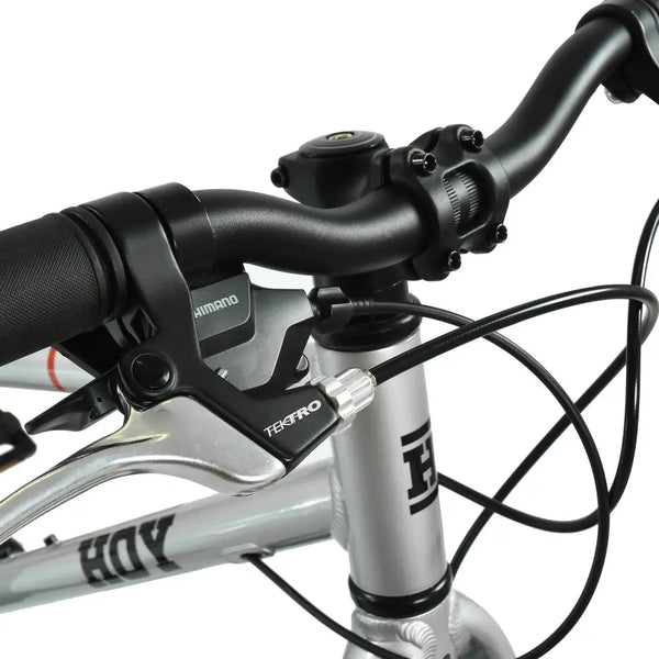 Detailed shot of the Shimano/Tektro brake and shifter lever assembly on the HOY Pentland 20".