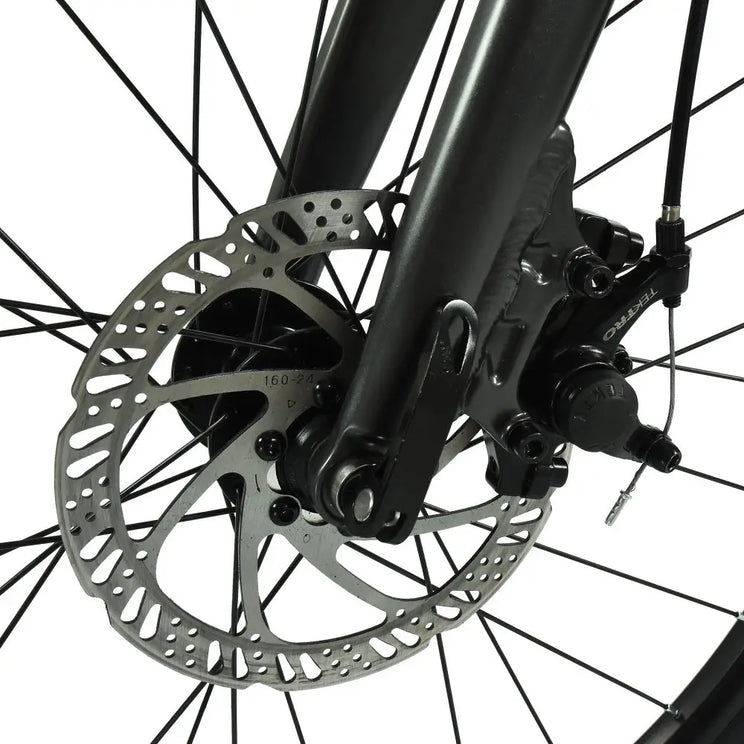 Close-up of the Tektro mechanical disc brake caliper and rotor on the HOY Pentland kids' bike.