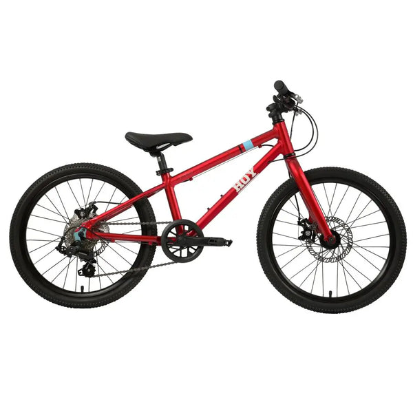 Front view of the HOY Pentland kids bike in red featuring a 10-year warranty badge and disc brakes.