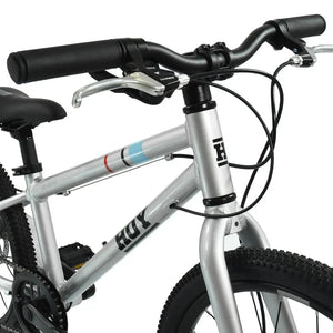 Handlebars, Tektro brake levers and HOY head tube logo on the Titanium Silver HOY Pentland 20-inch