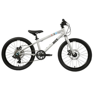 Front view of the HOY Pentland kids bike in silver, featuring a 10-year warranty badge and disc brakes.