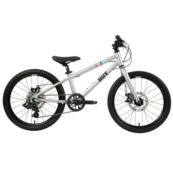 Front view of the HOY Pentland kids bike in silver, featuring a 10-year warranty badge and disc brakes.