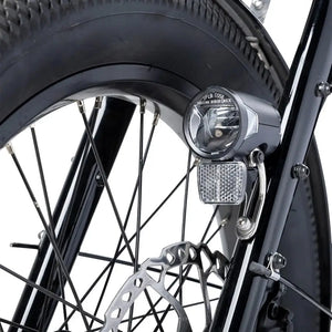 Close up of the Humber Flex LT front light and hydraulic disc brake on the front wheel.