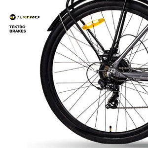 Detail view of the high-performance Tektro hydraulic disc brakes on the rear wheel of the Hygge Aarhus electric bike.