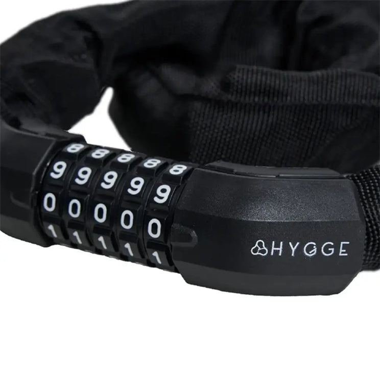 Close-up of the high-security 5-digit combination mechanism on a Hygge chain lock, displaying the white numbering and branding.