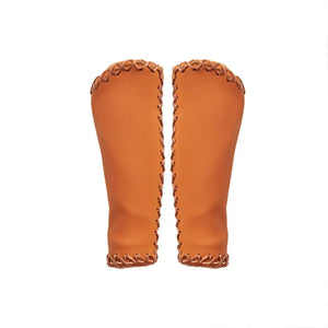 A pair of Hygge classic brown leather bicycle grips featuring a vintage cross-stitched pattern and ergonomic shape.