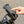 Close-up of a cyclist’s hand using a smartphone navigation app while the device is secured in a rugged Hygge handlebar phone holder.