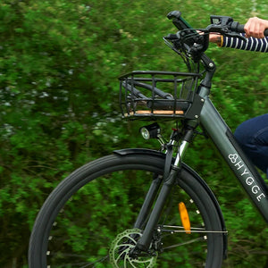 Low-angle view of a durable wire mesh front basket securely attached to a bicycle, showcasing its robust construction and capacity for storage.