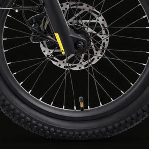Hygge Herlev electric bike front wheel with disc brake and tyre tread for urban commuting.