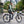 Rider with a rucksack on the white Hygge Lossø commuter electric bike in the city.
