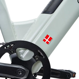 Frame and crank area of Hygge Lossø electric bike with Denmark design badge and step-through frame detail.
