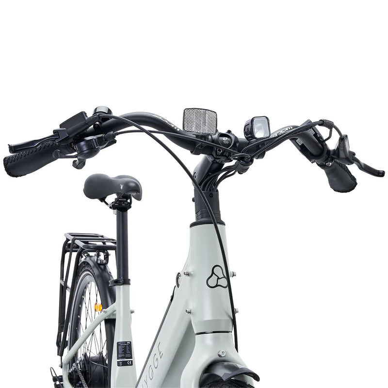 Top-down view of the handlebars, integrated lights, and cables on the Hygge Nivø electric bike.