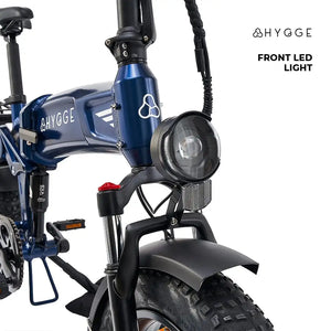 Front view of the Hygge Sorø 2025 featuring a large LED headlight and front suspension fork for smooth riding.