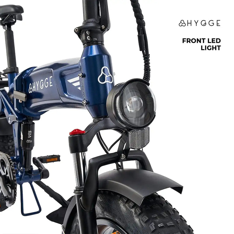 Front view of the Hygge Sorø 2025 featuring a large LED headlight and front suspension fork for smooth riding.