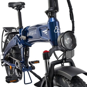 The blue Hygge Sorø electric bike front suspension fork with integrated LED headlight for improved comfort and visibility.