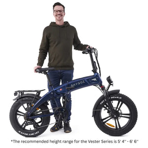 Hygge Sorø folding electric bike shown with rider for size reference and recommended height range.