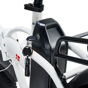 Hygge Vester electric bike battery mounted on frame with integrated lock and key for added security.