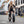 Woman riding Hygge Vester folding electric bike on a city street, ideal for urban commuting with fat tyre stability.