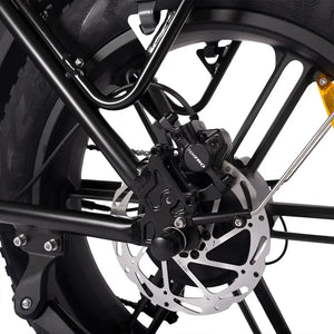 Close-up of Hygge Vester electric bike rear disc brake and fat tyre for strong stopping power and stability.