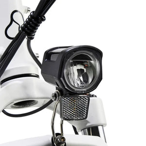Hygge Vester electric bike LED front light with integrated reflector for improved visibility and safe riding in low-light conditions.