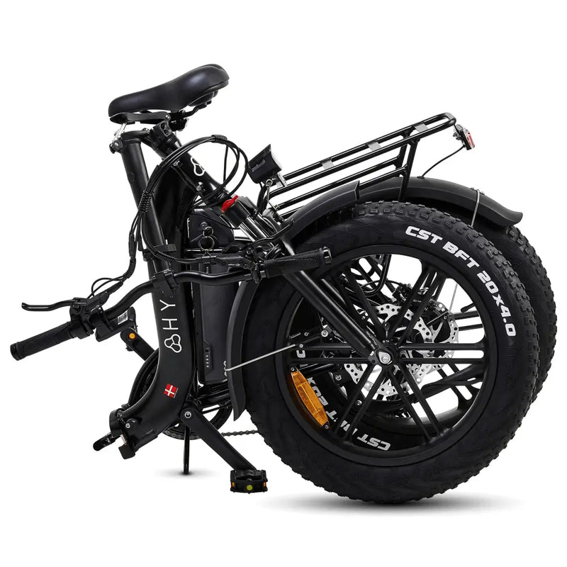 The black Hygge Vester Step electric bike in its fully folded position, demonstrating its compact size for storage.