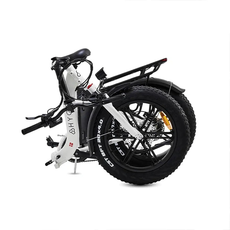 The white Hygge Vester Step electric bike in its fully folded position, demonstrating its compact size for storage.
