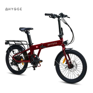 Full side profile of the 2025 Hygge Virum electric folding bike in red, showing the step-through frame and battery position.