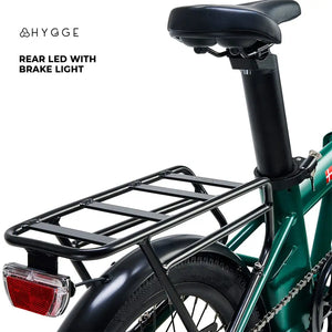 The sturdy rear pannier rack and integrated red LED brake light on the Hygge Virum electric bike.