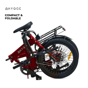 he red Hygge Virum e-bike in its fully folded state, demonstrating its compact dimensions for easy storage.
