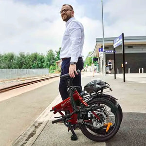 Folded Hygge Virum Folding Electric Bike standing on a train platform ready for public transport use.