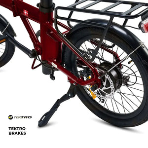 The rear wheel of the red Hygge Virum equipped with Tektro disc brakes and a sturdy kickstand for safety and stability.