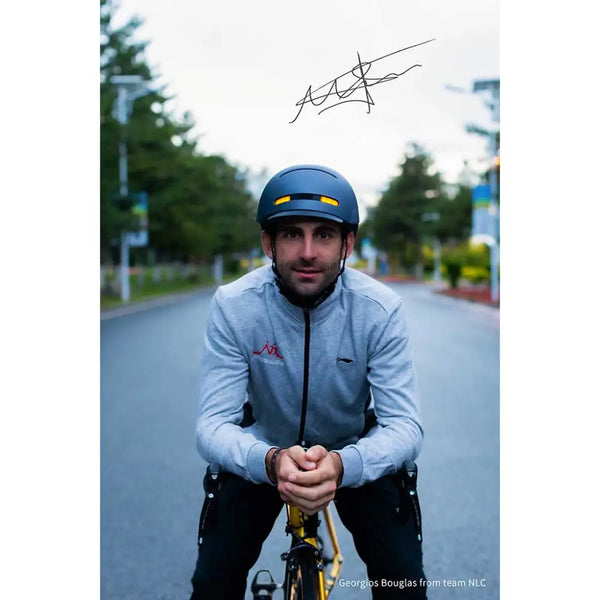 Front view of a cyclist wearing the Livall BH51M Neo smart helmet, highlighting integrated LED lights for enhanced visibility.