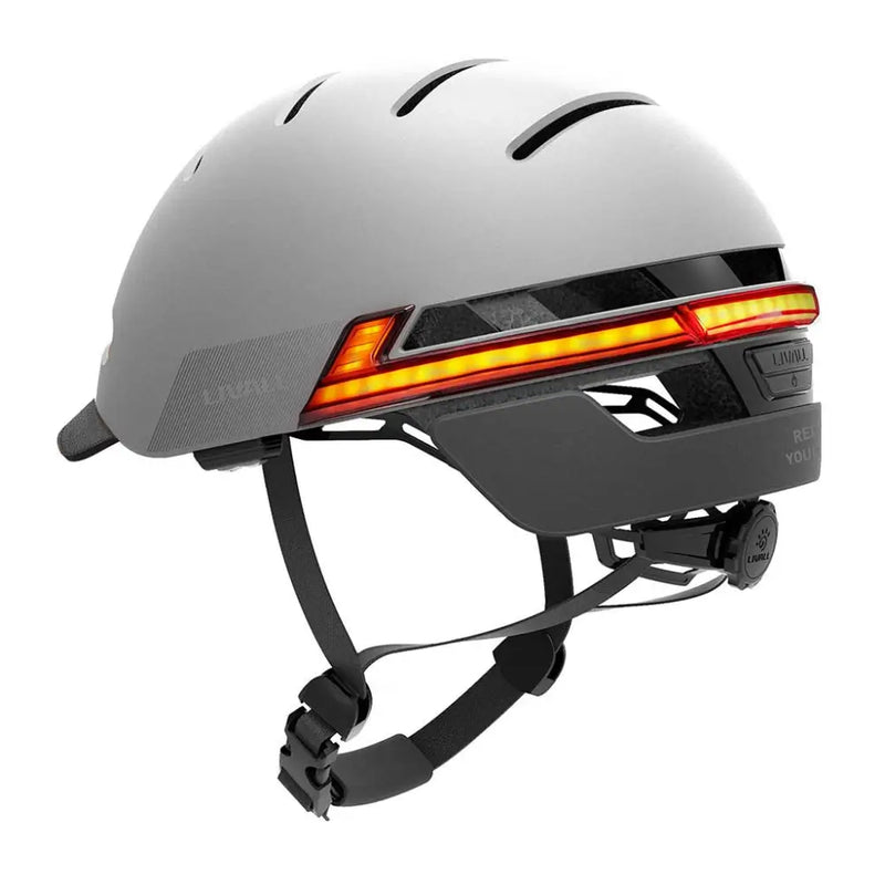 Rear view of the Livall BH51M Neo smart cycling helmet in grey showing bright LED light strip for enhanced road visibility.
