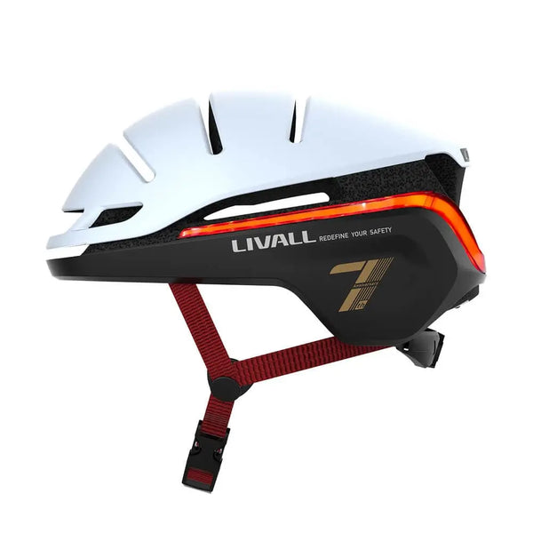 Angled side view of the Livall EVO21 smart cycling helmet in white with red straps, highlighting LED light strip and safety-focused design.